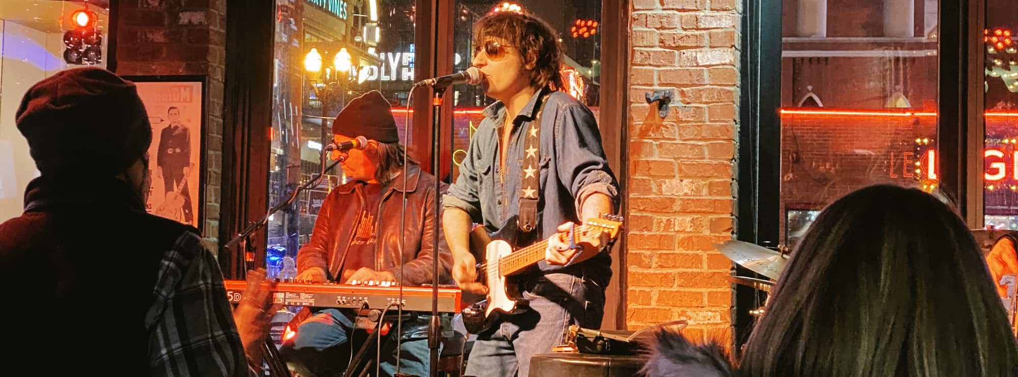 bar singer on guitar in Baltimore