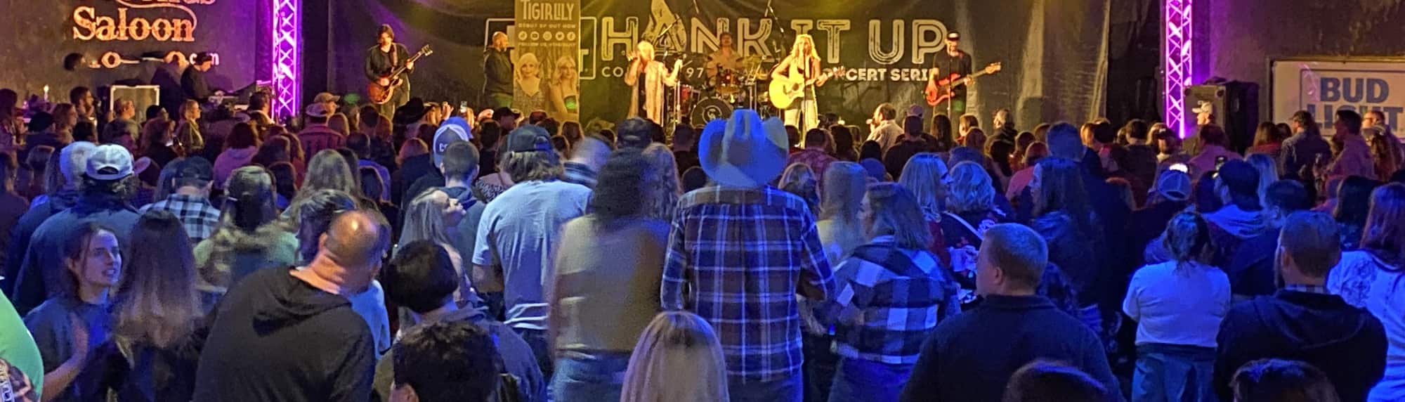 country concert with fans wearing cowboy hats Baltimore